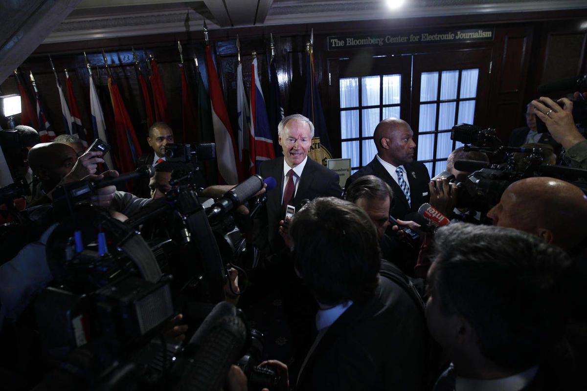 National School Shield Task Force Director, former Arkansas Rep. Asa Hutchinson speaks with reporters after a news conference  at National Press Club in Washington, on Tuesday, April 2, 2013. The National School Shield program is a frame work to arm secur