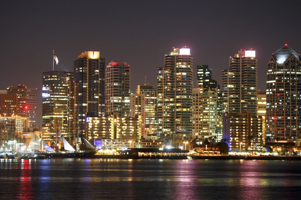 The San Diego skyline mixed with highrise condos and office buildings sparkles in the early evening