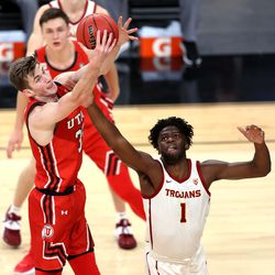Utah Utes center Branden Carlson (35) works to control the ball for a rebound over USC Trojans forward Chevez Goodwin (1) as Utah and USC play in the Pac-12 Tournament at T-Mobile Arena in Las Vegas on Thursday, March 11, 2021.
