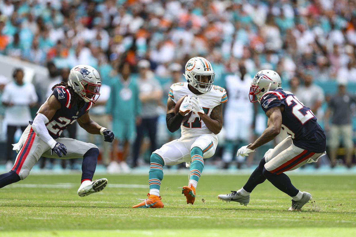 Jaylen Waddle of the Miami Dolphins runs the ball during an NFL football game against the New England Patriots at Hard Rock Stadium on October 29, 2023 in Miami Gardens, Florida.