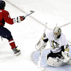 Washington Capitals' Alex Ovechkin (8), of Russia, scores a goal against Pittsburgh Penguins goalie Marc-Andre Fleury during the second period.