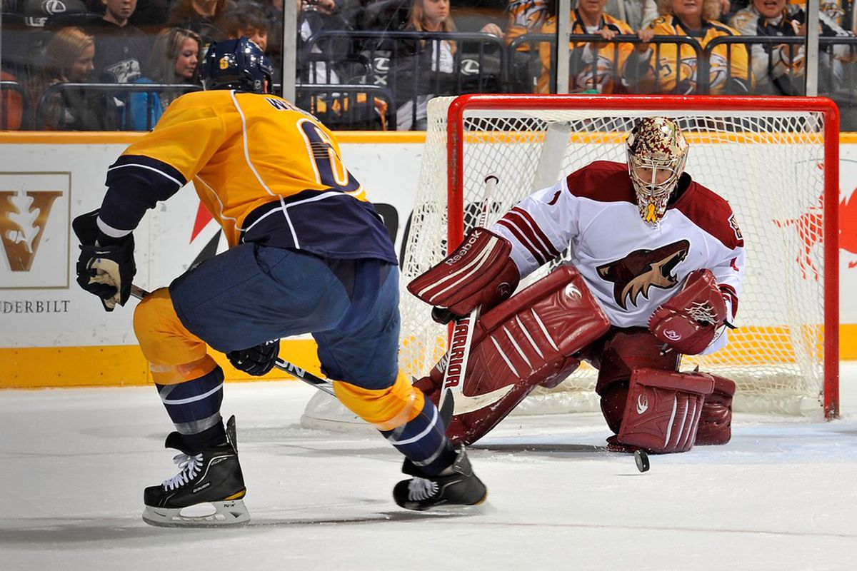 NASHVILLE, TN - DECEMBER 06: Goalie  Jason LaBarbera #1 of the Phoenix Coyotes makes a save on Shea Weber #6 of the Nashville Predators at the Bridgestone Arena on December 6, 2011 in Nashville, Tennessee.  (Photo by Frederick Breedon/Getty Images)