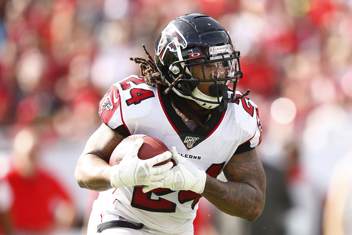 Devonta Freeman #24 of the Atlanta Falcons in action against the Tampa Bay Buccaneers during the first half at Raymond James Stadium on December 29, 2019 in Tampa, Florida.