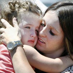 Tosha Stevenson hugs her daughter, Taleah, as they arrive for their flight home to St. George with members of Angel Flight West on Monday, June 3, 2013.