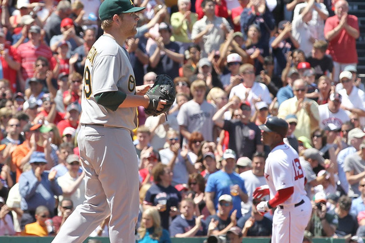 BOSTON, MA - JUNE 5: Brett Anderson #49 of the Oakland Athletics gives up a home run to Carl Crawford #13 of the Boston Red Sox, who is rounding third, at Fenway Park on June 5, 2011 in Boston, Massachusetts. (Photo by Jim Rogash/Getty Images)