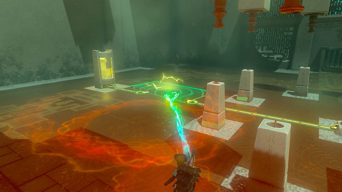 Link grabs a metal plate using Ultrahand in part 1 of the Turbine Power puzzle in Gemimik Shrine