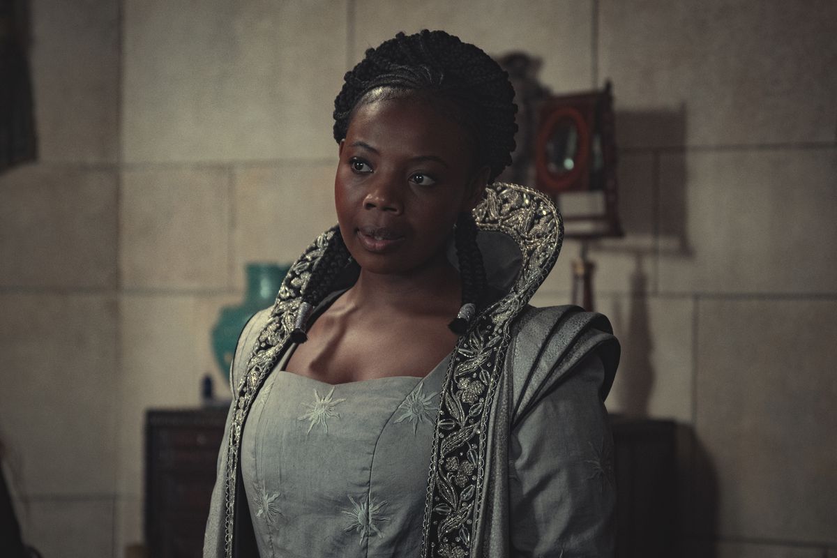 Fringilla (Mimi Ndiweni) talking to someone off-screen in a still from The Witcher season 2