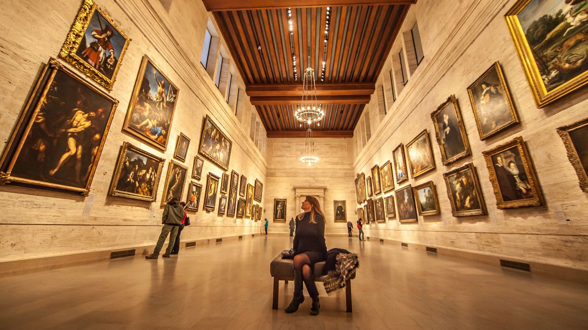 A woman sits in the Museum of Fine Arts, Boston