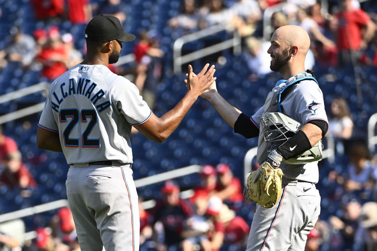 Miami Marlins starting pitcher Sandy Alcantara (22) is congratulated by Miami Marlins catcher Jacob Stallings (58) after the game against the Washington Nationals at Nationals Park.&nbsp;
