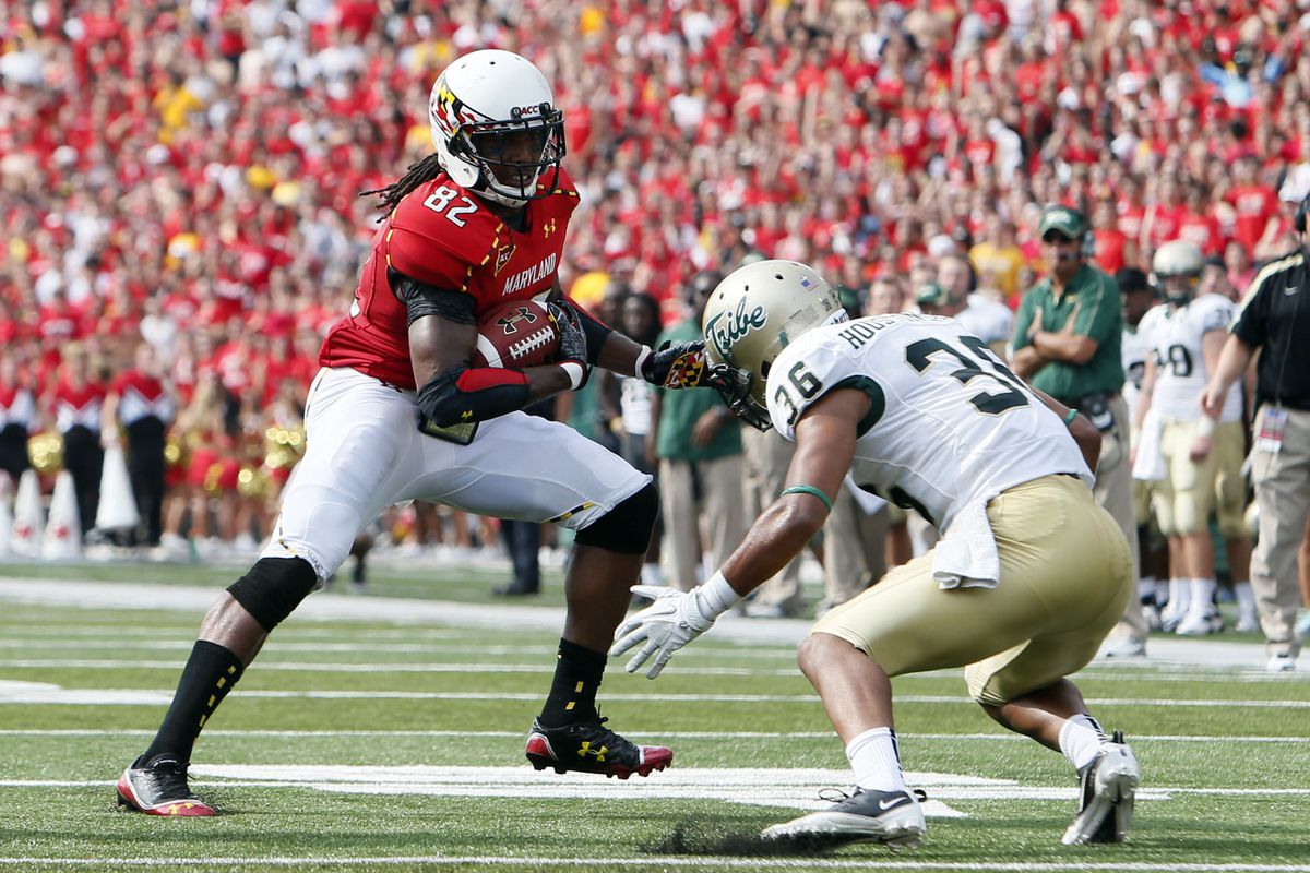September 1, 2012; College Park, MD, USA;  Maryland Terrapins wide receiver Marcus Leak (82) attempts to run past William & Mary Tribe cornerback DeAndre Houston-Carson (36) at Byrd Stadium. Mandatory Credit: Mitch Stringer-US PRESSWIRE