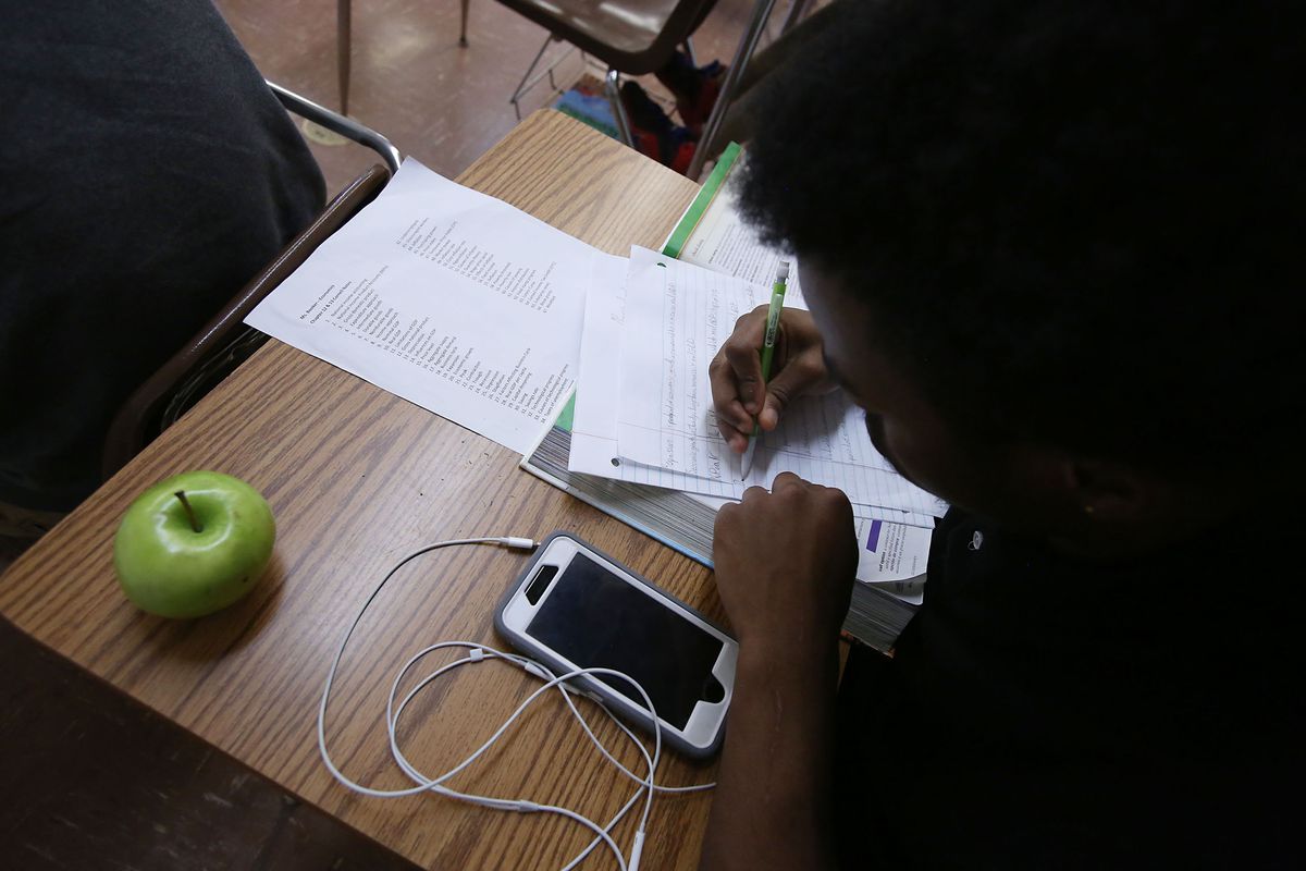A student works at a desk in a classroom at Hillcrest High School in Memphis – one of five high schools in the Achievement School District.