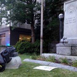 A toppled Confederate statue lies on the ground on Monday, Aug. 14, 2017, in Durham, N.C. Activists on Monday evening used a rope to pull down the monument outside a Durham courthouse. The Durham protest was in response to a white nationalist rally held in Charlottesville, Va, over the weekend. Authorities say one woman was killed Saturday after one of the white nationalists drove his car into a group of counterprotesters. (AP Photo/Jonathan Drew)