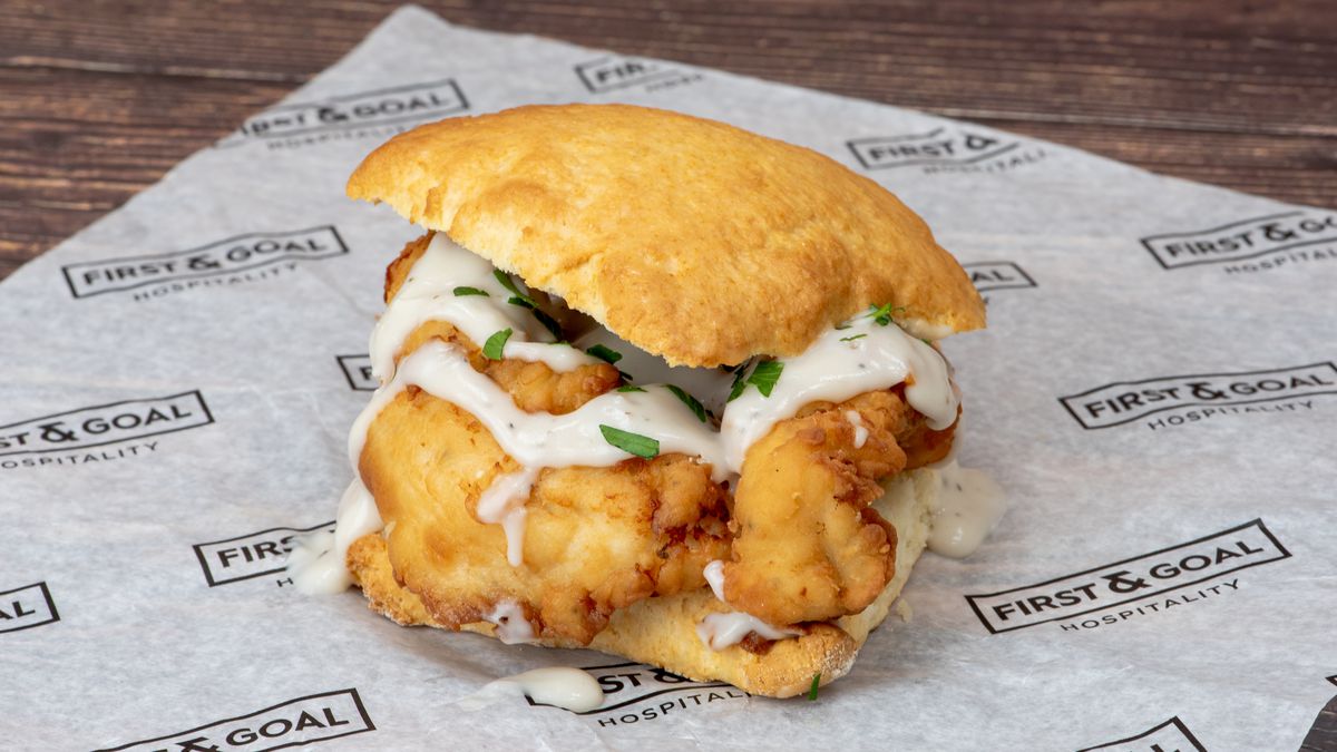 CenturyLink Field will feature this fried chicken and biscuit sandwich smothered in gravy.