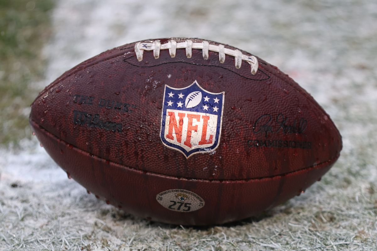 KANSAS CITY, MO - JANUARY 21: A view of a football with the NFL logo before an AFC divisional playoff game between the Jacksonville Jaguars and Kansas City Chiefs on January 21, 2023 at GEHA Field at Arrowhead Stadium in Kansas City, MO.