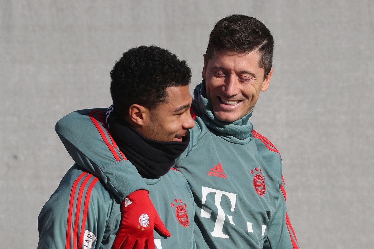 MUNICH, GERMANY - JANUARY 31: Robert Lewandowski (L) and Serge Gnabry of FC Bayern Muenchen arrive for a training session at the club's Saebener Strasse training ground on January 31, 2019 in Munich, Germany.