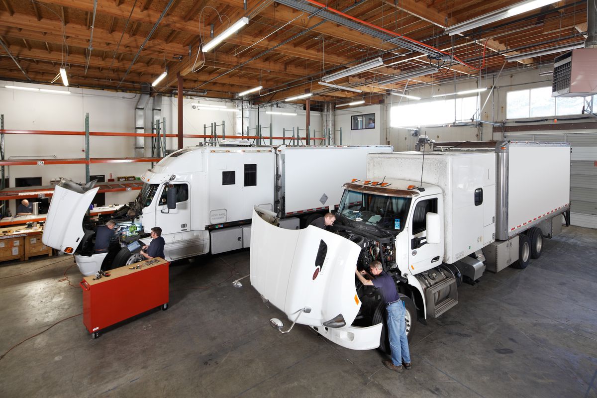Working in the HyTech garage, retrofitting big diesel trucks.