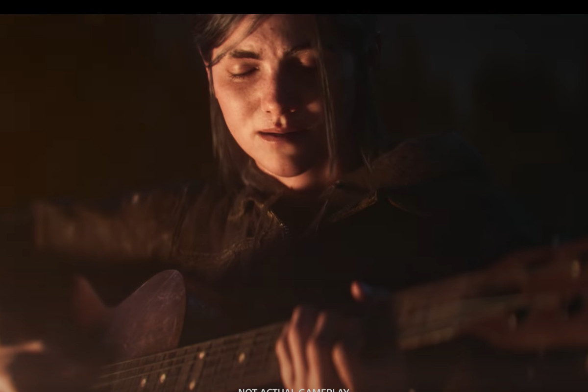 The Last of Us Part 2 character Ellie in the dark (but face lit) holding a guitar
