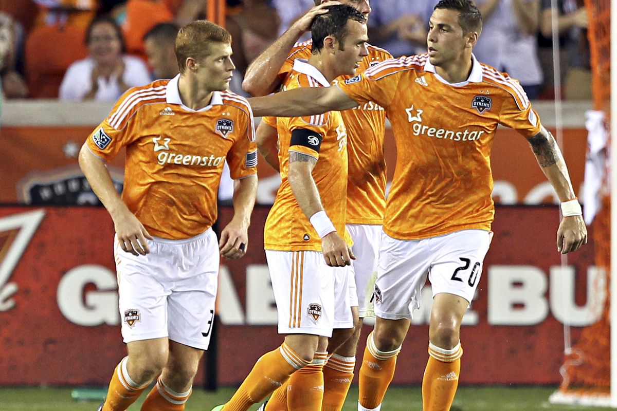 HOUSTON, TX - JULY 15:  Brad Davis #11 of the Houston Dynamo celebrates after scoring on a penalty kick against the D.C. United in the first half at BBVA Compass Stadium on July 15, 2012 in Houston, Texas. (Photo by Bob Levey/Getty Images)