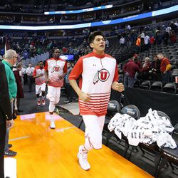 Utah Utes take the floor to warm up during the NCAA basketball tournament in Denver Thursday, March 17, 2016. 
