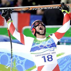 Switzerland's Didier Defago reacts after completing the Men's downhill at the Vancouver 2010 Olympics in Whistler, British Columbia, Monday.