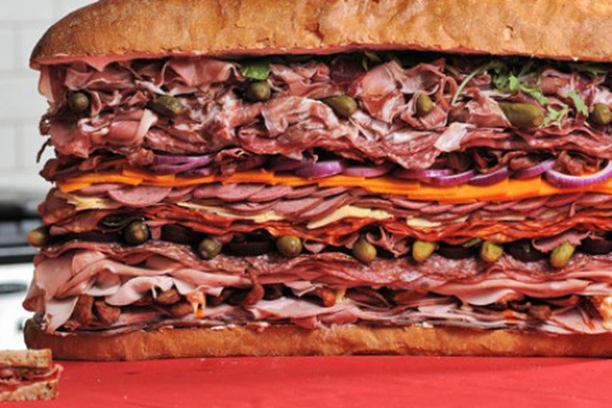 The World's Meatiest Sandwich, with regular sandwich for scale. 