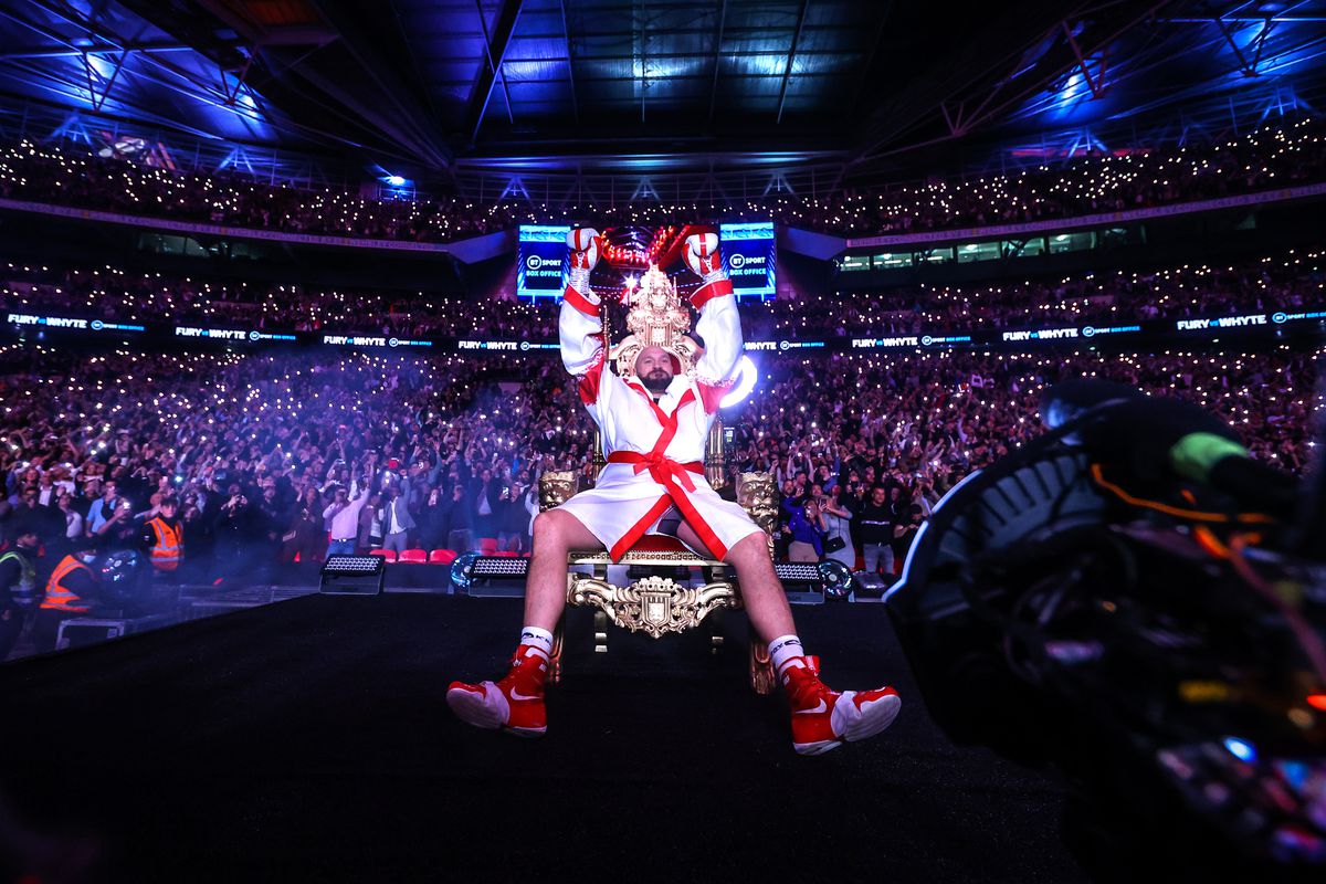 Tyson Fury sits on the throne before his WBC heavyweight championship fight with Dillian Whyte at Wembley Stadium on April 23, 2022 in London, England.
