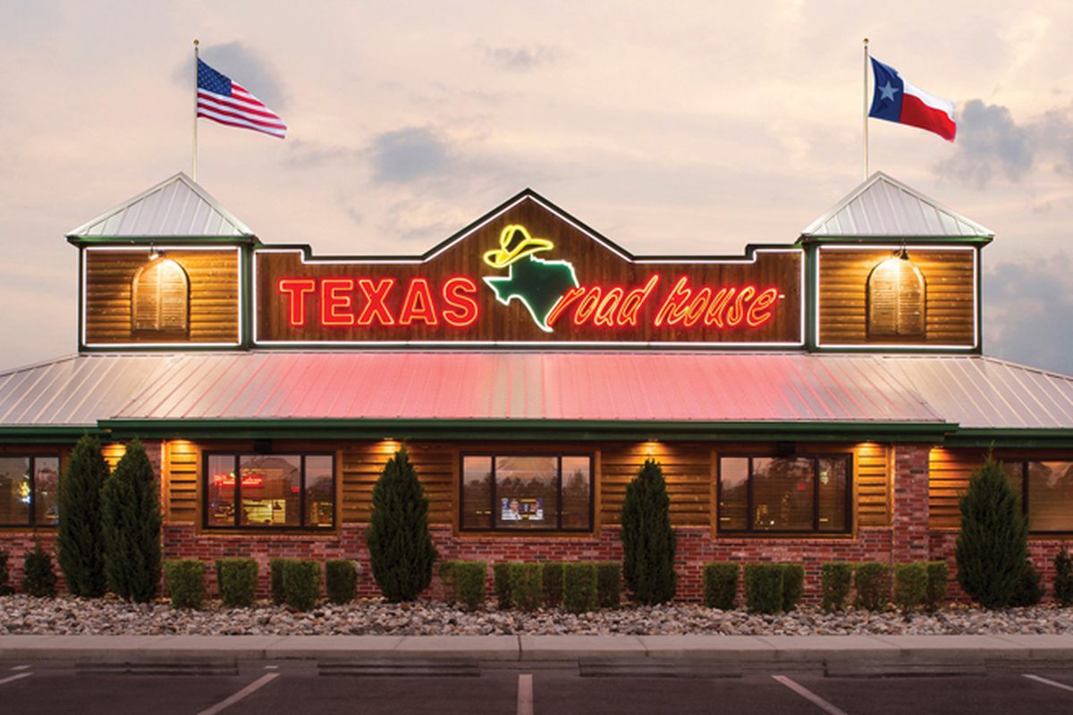 The exterior of the faux-rustic, flag-waving, Western-themed Texas Roadhouse, headed to Henderson.