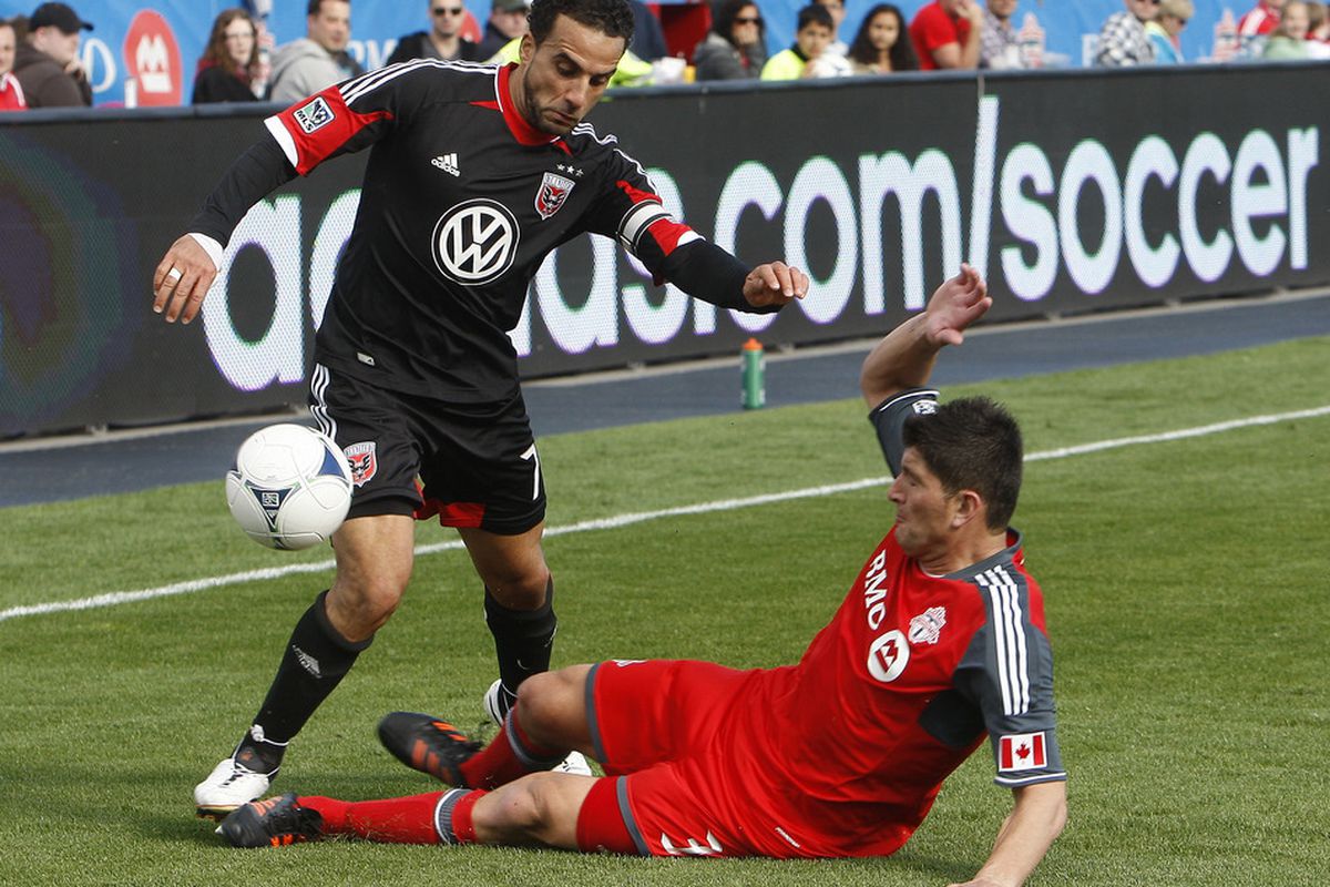 TORONTO, CANADA - MAY 5: Miguel Aceval #3 of Toronto FC bumps the ball off of Dwayne De Rosario #7 of DC United during MLS action at BMO Field May 5, 2012 in Toronto, Ontario, Canada.  (Photo by Abelimages/Getty Images)