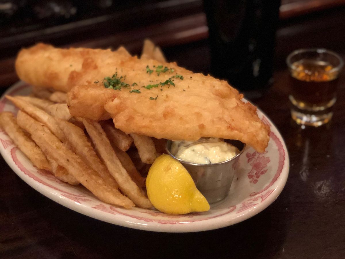 <span data-author="-1">Fish and chips with Guinness in the background</span>