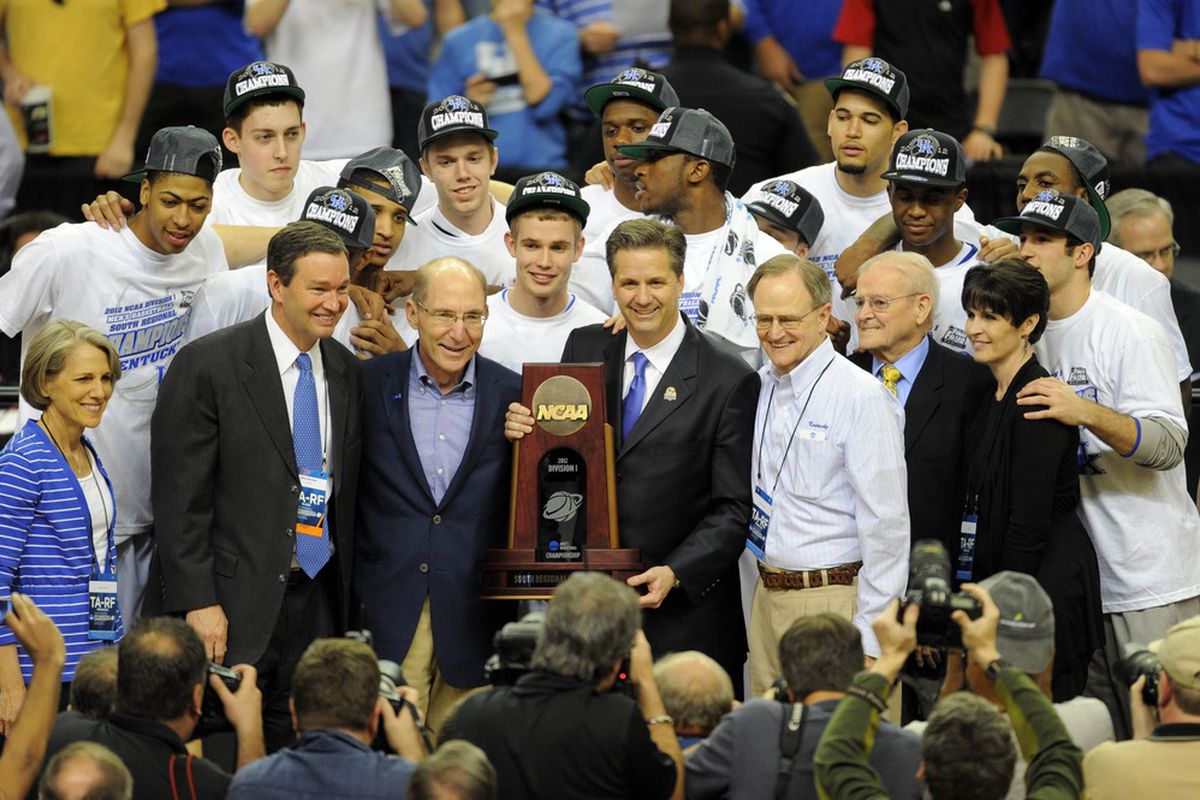Hopefully, the first of two trophy presentations (and who is that with his arm around Ellen Calipari?).