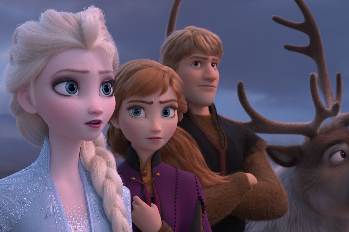 Princesses Elsa and Anna and their buddies Kristoff and Sven the reindeer stand together in Frozen II, looking off toward the horizon