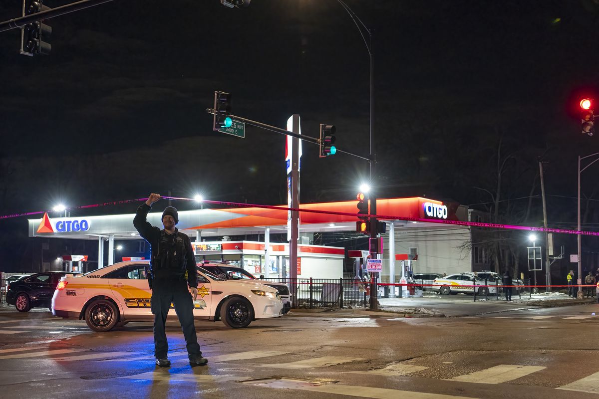Chicago police and Cook County Sheriffs deputies work the scene where a sheriff deputy shot and critically wounded a man during a shoot-out in the 7400 block of South Yates Boulevard in the South Shore neighborhood, Wednesday, Jan. 12, 2021.