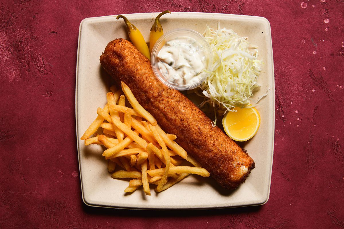 A selection of dishes including goulash, hot dogs, and stuffed rolled schnitzel.