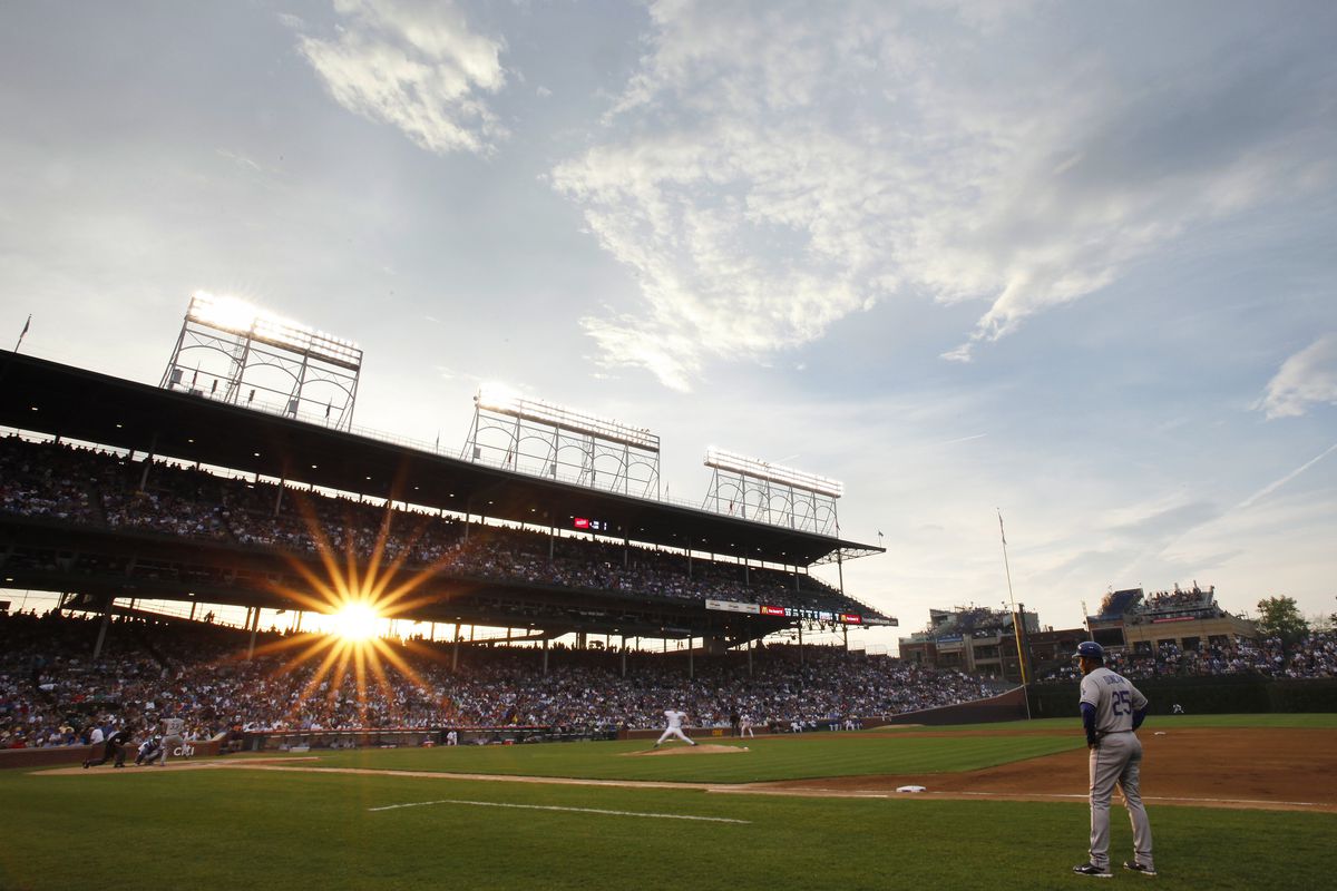 General view of the stadium as the sun sets behind the grandstand during the game between the Los Angeles Dodgers and the Chicago Cubs at Wrigley Field