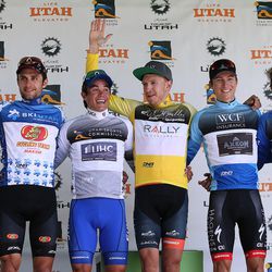 Stage 6 jersey winners, left to right, Most Aggressive Rider Giulio Ciccone, King of the Mountain Jacob Rathe, Sprint Leader Travis McCabe, Race Leader Robert Britton, Best Young Rider Neilson Powless and Most Promising Rookie Pier-Andre Cote wave to fans after Stage 6 of the Tour of Utah cycling race at Snowbird ski area on Saturday, Aug. 5, 2017.