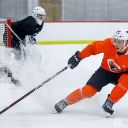 Morgan Frost (C) sprays the ice at the beginning of one-on-one drills at Flyers Rookie Camp.