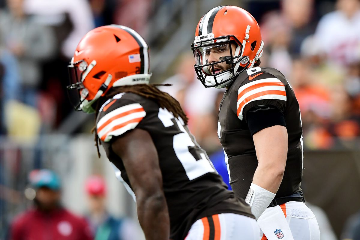 Baker Mayfield #6 and Kareem Hunt #27 of the Cleveland Browns prepare for the play during a game against the Arizona Cardinals at FirstEnergy Stadium on October 17, 2021 in Cleveland, Ohio.
