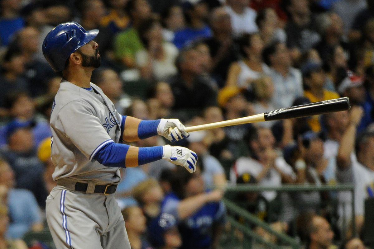 June 18, 2012; Milwaukee, WI, USA;  Toronto Blue Jays right fielder Jose Bautista (19) watches his 3-run home run against the Milwaukee Brewers in the seventh inning at Miller Park.  Mandatory Credit: Benny Sieu-US PRESSWIRE