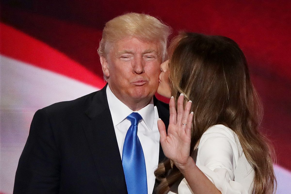 Melania Trump kissing Donald Trump.