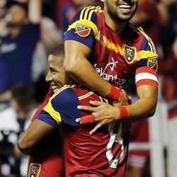 Javier Morales (11) of Real Salt Lake is lifted by Joao Plata (8) after Morales scores against Sporting KC during MLS soccer at Rio Tinto Stadium in Sandy, Friday, July 24, 2015.
