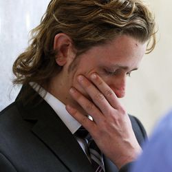 Court Einfeldt, who lost his sister to domestic violence, wipes a tear following a press conference held by the Utah Domestic Violence Coalition at the Capitol in Salt Lake City, Monday, Feb. 9, 2015.