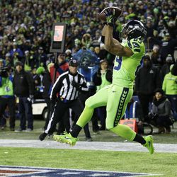 Seattle Seahawks wide receiver Doug Baldwin catches a pass in the end zone for a touchdown against the Los Angeles Rams in the second half of an NFL football game, Thursday, Dec. 15, 2016, in Seattle. 