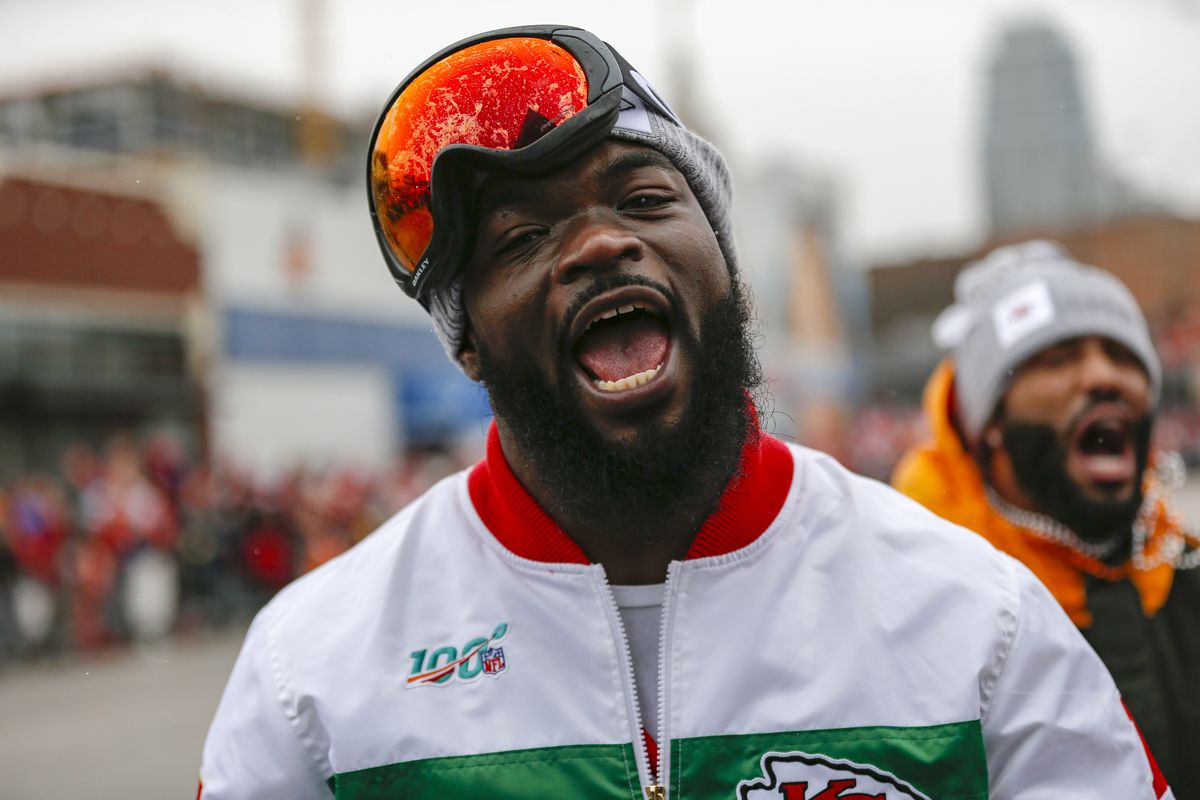 Damien Williams of the Kansas City Chiefs (white jacket) celebrates on February 5, 2020 in Kansas City, Missouri during the city’s celebration parade for the Chiefs victory in Super Bowl LIV.