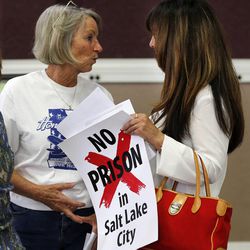 Shauna Peck, left, talks with Kathy Hansen during a public open house in Salt Lake City, Wednesday, May 20, 2015, for citizens to learn about the five potential sites for the new Utah State Correctional Facility.