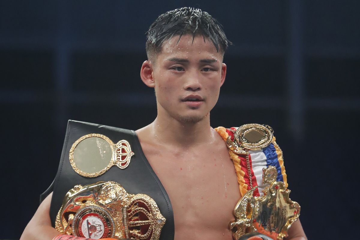 Hiroto Kyoguchi poses with his belts after winning the WBA and Ring Magazine World titles fight against Esteban Bermudez at Domo Alcalde on June 10, 2022 in Guadalajara, Mexico.