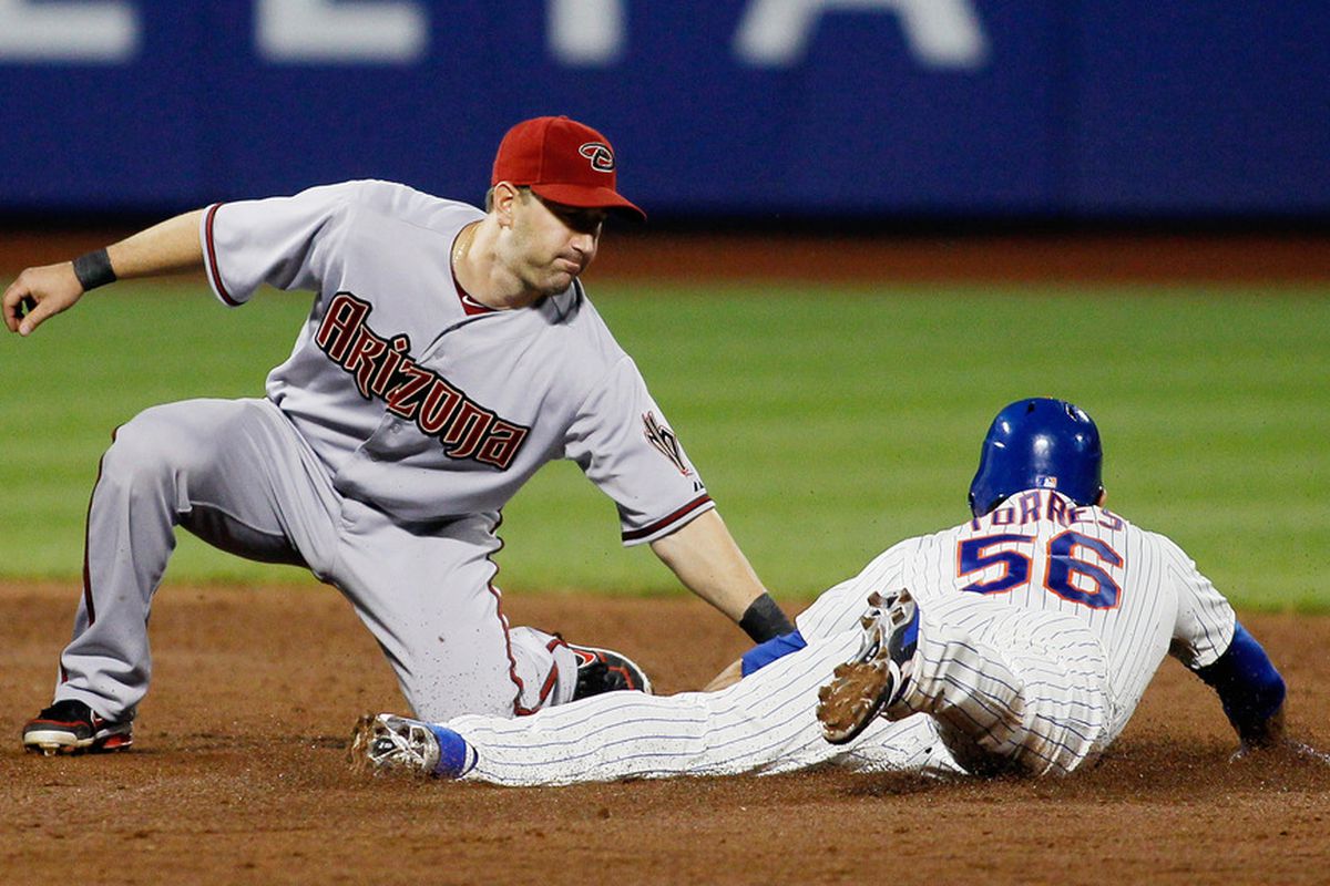 Willie Bloomquist (18) of the Arizona Diamondbacks tags out Andres Torres (56) of the New York Mets tying to steal secondbase at CitiFied on May 5, 2012. (Photo by Mike Stobe/Getty Images)