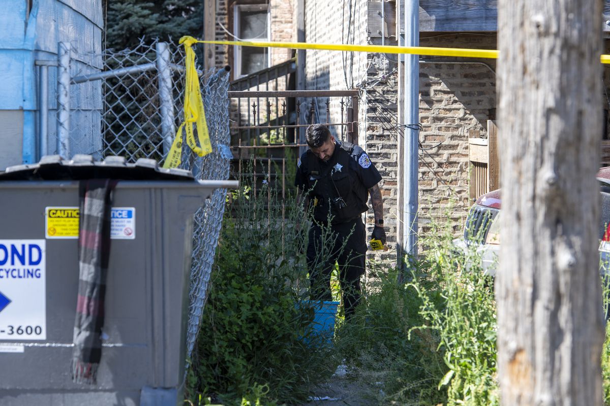 Chicago police work the scene where a 14-year-old by was shot and killed in the 1100 block of South Karlov Ave, in the Lawndale neighborhood, Thursday, June 10, 2021.