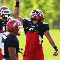 Linebacker Kavika Laufatasaga reacts after a play as the University of Utah team practices in Salt Lake City on Tuesday, Aug. 1, 2017.