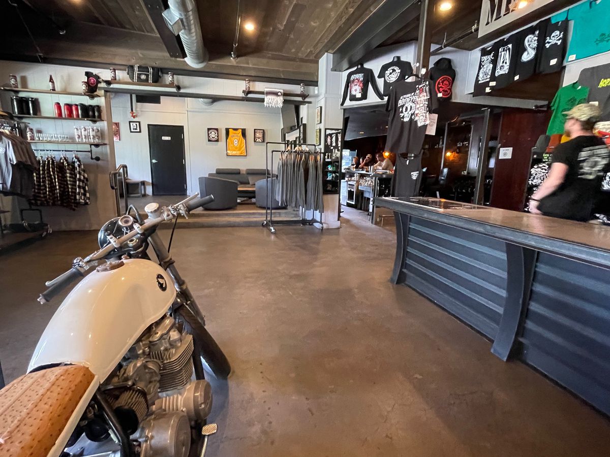 Motorcycle inside Boneyard Brew pub with lounge in the background