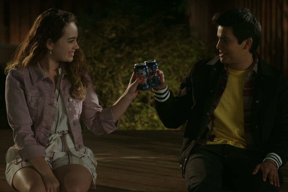 MARY MOUSER as SAMANTHA LARUSSO and XOLO MARIDUENA as MIGUEL DIAZ cheers beers, baby!